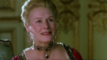 Movie still from “Dangerous Liaisons” (1988), directed by Stephen Frears – A person wearing a necklace and earrings; Close Up shot, Low angle