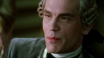 Movie still from “Dangerous Liaisons” (1988), directed by Stephen Frears – A man that is wearing a wig; Close Up shot, Over the shoulder angle