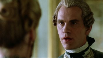 Movie still from “Dangerous Liaisons” (1988), directed by Stephen Frears – A person wearing a wig and looking at another person; Close Up shot, Over the shoulder angle