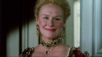 Movie still from “Dangerous Liaisons” (1988), directed by Stephen Frears – An older woman wearing a necklace and earrings; Close Up shot, Low angle