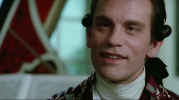 Movie still from “Dangerous Liaisons” (1988), directed by Stephen Frears – A person wearing a neck brace; Close Up shot, Low angle