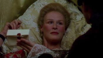 Movie still from “Dangerous Liaisons” (1988), directed by Stephen Frears – A person holding a cell phone; Close Up shot, Overhead angle