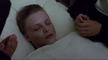 Movie still from “Dangerous Liaisons” (1988), directed by Stephen Frears – A woman laying in a bed next to a man; Close Up shot, High angle