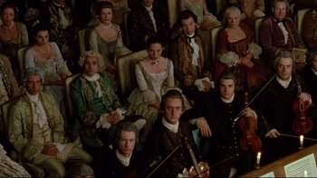 Movie still from “Dangerous Liaisons” (1988), directed by Stephen Frears – A group of people dressed in period costumes; Wide shot, High angle
