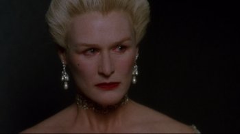 Movie still from “Dangerous Liaisons” (1988), directed by Stephen Frears – A person wearing a necklace and earrings; Close Up shot, Over the shoulder angle