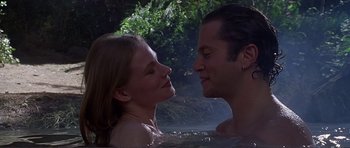 Movie still from “Dante's Peak” (1997), directed by Roger Donaldson – A man and a woman in a pool of water; Close Up shot, High angle