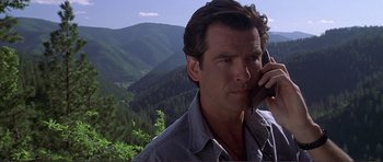 Movie still from “Dante's Peak” (1997), directed by Roger Donaldson – A person talking on a cell phone; Close Up shot, Low angle
