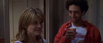 Movie still from “Dante's Peak” (1997), directed by Roger Donaldson – A man and a woman are looking at a cell phone; Close Up shot, Over the shoulder angle