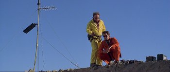 Movie still from “Dante's Peak” (1997), directed by Roger Donaldson – Two men standing on top of a hill; Wide shot, Low angle