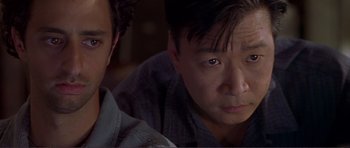 Movie still from “Dante's Peak” (1997), directed by Roger Donaldson – Two men sitting next to each other in front of a window; Close Up shot, High angle