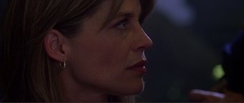 Movie still from “Dante's Peak” (1997), directed by Roger Donaldson – A woman's face in the dark; Close Up shot, Low angle