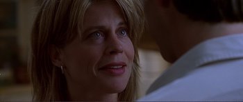 Movie still from “Dante's Peak” (1997), directed by Roger Donaldson – A woman's face as she looks at the camera; Close Up shot, Over the shoulder angle