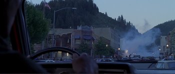 Movie still from “Dante's Peak” (1997), directed by Roger Donaldson – A view from inside a car looking out the window; Extreme Wide shot, Over the shoulder angle