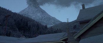 Movie still from “Dante's Peak” (1997), directed by Roger Donaldson – A snowy mountain with trees in the background; Extreme Wide shot, Low angle