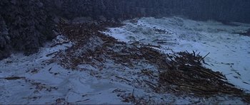 Movie still from “Dante's Peak” (1997), directed by Roger Donaldson – A large pile of debris on top of a snow covered slope; Extreme Wide shot, High angle
