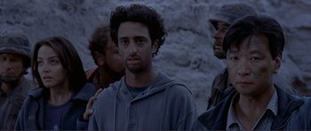 Movie still from “Dante's Peak” (1997), directed by Roger Donaldson – A group of men standing next to each other in the snow; Close Up shot, Over the shoulder angle