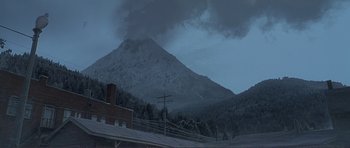 Movie still from “Dante's Peak” (1997), directed by Roger Donaldson – A view of a mountain with a plume of smoke coming from it; Extreme Wide shot, Low angle