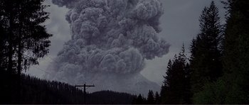 Movie still from “Dante's Peak” (1997), directed by Roger Donaldson – A very large plume of smoke coming out of a mountain; Extreme Wide shot, High angle