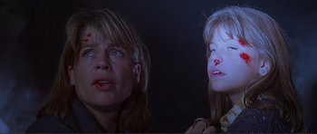 Movie still from “Dante's Peak” (1997), directed by Roger Donaldson – A woman and a girl with blood on their face; Close Up shot, Low angle