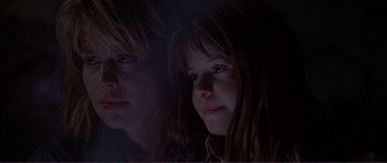 Movie still from “Dante's Peak” (1997), directed by Roger Donaldson – Two young girls looking at the camera in the dark; Close Up shot, Low angle