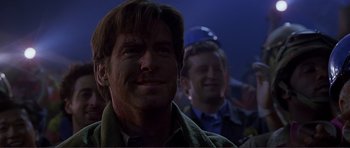 Movie still from “Dante's Peak” (1997), directed by Roger Donaldson – A man with blood all over his face; Close Up shot, Over the shoulder angle