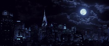 Movie still from “Daredevil” (2003), directed by Mark Steven Johnson – A view of a city skyline at night with a cloudy sky; Extreme Wide shot, Low angle