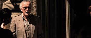 Movie still from “Daredevil” (2003), directed by Mark Steven Johnson – An older man wearing a suit and glasses; Close Up shot, Over the shoulder angle