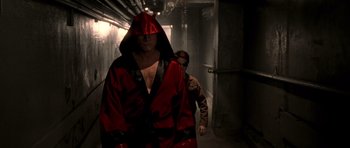 Movie still from “Daredevil” (2003), directed by Mark Steven Johnson – A man in a red robe and a man in a brown jacket; Medium shot, Low angle