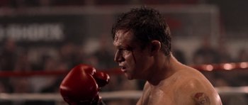 Movie still from “Daredevil” (2003), directed by Mark Steven Johnson – A person wearing a boxing glove; Close Up shot, Low angle