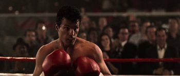 Movie still from “Daredevil” (2003), directed by Mark Steven Johnson – A man in a boxing ring wearing red gloves; Close Up shot, Low angle