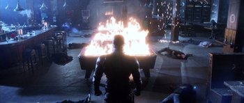 Movie still from “Daredevil” (2003), directed by Mark Steven Johnson – A man standing in front of a fire pit; Wide shot, High angle