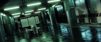 Movie still from “Daredevil” (2003), directed by Mark Steven Johnson – A parking garage with a lot of lights on the ceiling; Extreme Wide shot, High angle