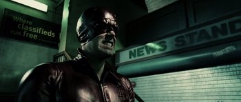 Movie still from “Daredevil” (2003), directed by Mark Steven Johnson – A man wearing a red leather jacket and a red helmet; Close Up shot, Low angle