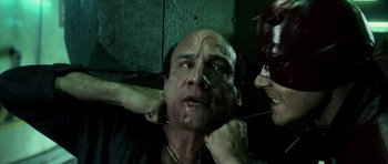 Movie still from “Daredevil” (2003), directed by Mark Steven Johnson – A man with his face covered by a woman's hand; Close Up shot, High angle