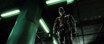 Movie still from “Daredevil” (2003), directed by Mark Steven Johnson – A man dressed in a red suit and black mask; Medium shot, Low angle