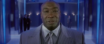 Movie still from “Daredevil” (2003), directed by Mark Steven Johnson – A person wearing a suit and tie; Close Up shot, Low angle