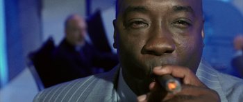 Movie still from “Daredevil” (2003), directed by Mark Steven Johnson – A man smoking a cigarette; Extreme Close Up shot, Low angle
