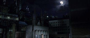 Movie still from “Daredevil” (2003), directed by Mark Steven Johnson – A full moon rises over a city at night; Extreme Wide shot, Low angle