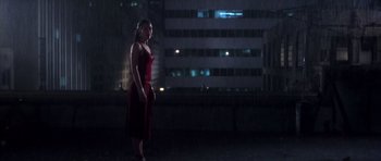 Movie still from “Daredevil” (2003), directed by Mark Steven Johnson – A woman in a red dress standing in the dark; Wide shot, Low angle