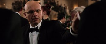 Movie still from “Daredevil” (2003), directed by Mark Steven Johnson – A bald man in a suit and bow tie; Close Up shot, Low angle