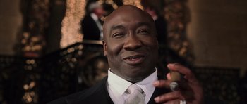 Movie still from “Daredevil” (2003), directed by Mark Steven Johnson – A person wearing a suit and tie; Close Up shot, Low angle