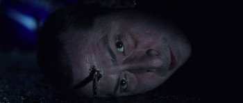 Movie still from “Daredevil” (2003), directed by Mark Steven Johnson – A person with a knife in his mouth; Close Up shot, Overhead angle