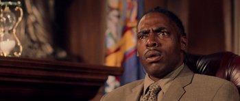 Movie still from “Daredevil” (2003), directed by Mark Steven Johnson – A person wearing a suit and tie; Close Up shot, Low angle