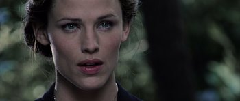 Movie still from “Daredevil” (2003), directed by Mark Steven Johnson – A woman's face with green eyes; Close Up shot, Over the shoulder angle