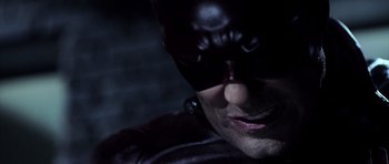 Movie still from “Daredevil” (2003), directed by Mark Steven Johnson – A person wearing a batman mask; Close Up shot, Low angle