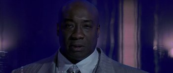 Movie still from “Daredevil” (2003), directed by Mark Steven Johnson – A person wearing a suit and tie; Close Up shot, Low angle