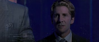 Movie still from “Daredevil” (2003), directed by Mark Steven Johnson – A person wearing a suit and tie; Close Up shot, Over the shoulder angle