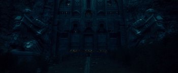 Movie still from “The Hobbit: An Unexpected Journey” (2012), directed by Peter Jackson – An image of a dark room with lights in the background; Extreme Wide shot, Low angle