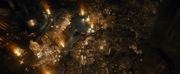 Movie still from “The Hobbit: An Unexpected Journey” (2012), directed by Peter Jackson – An aerial view of a city filled with lots of trash; Extreme Wide shot, Overhead angle
