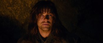 Movie still from “The Hobbit: An Unexpected Journey” (2012), directed by Peter Jackson – A person with long brown hair; Close Up shot, Low angle